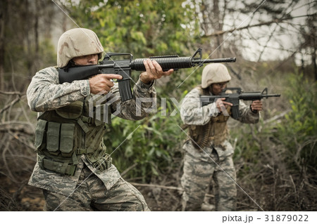 Military soldiers during training exercise with weapon Military soldiers during training exercise with weapon 31879022