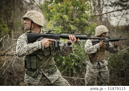 Military soldiers during training exercise with weapon Military soldiers during training exercise with weapon 31879115