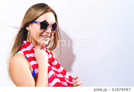 Young woman with USA national holiday accessories 31879487