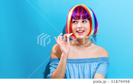 Party theme with woman in colorful wig Party theme with woman in colorful wig 31879498