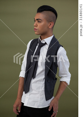 Transgender standing against green background 31880141