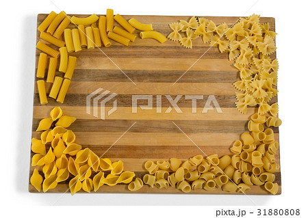 Various pasta on cutting board 31880808