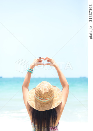 Happy woman on the beach in summer 31887568