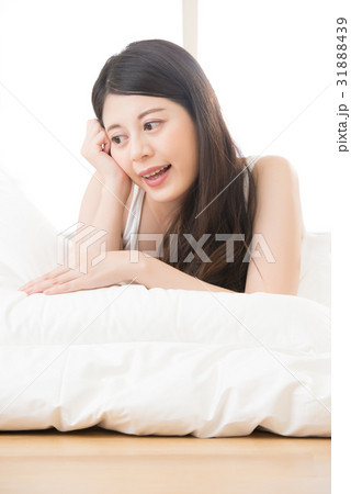 beautiful health asian woman feel carefree on bed 31888439