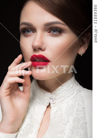 Beautiful girl with red lips in white clothes in Beautiful girl with red lips in white clothes in 31889360