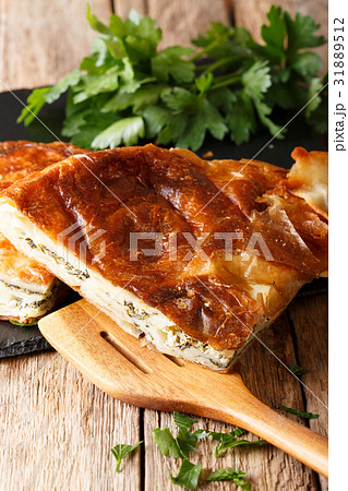 Freshly baked burek stuffed with spinach Freshly baked burek stuffed with spinach 31889512