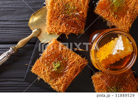Turkish dessert kunefe with pistachio powder Turkish dessert kunefe with pistachio powder 31889529