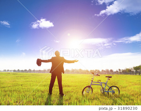 businessman relaxing in green land and businessman relaxing in green land and 31890230