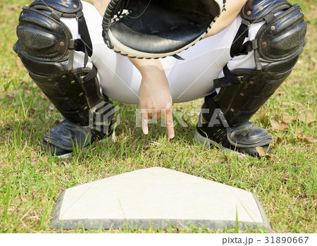 baseball catcher showing gesture for secret sign 31890667