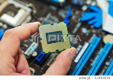 CPU in hand 31891639
