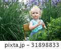Little girl in the garden. 31898833