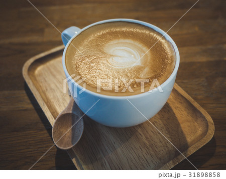 Latte coffee on wooden tray Latte coffee on wooden tray 31898858