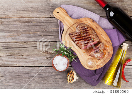 Grilled beef steak and wine 31899566