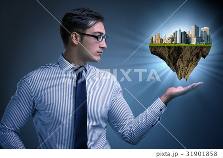 Architect holding plan of futuristic city Architect holding plan of futuristic city 31901858