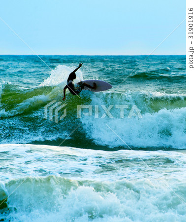 Surfer in the ocean. Bali 31901916