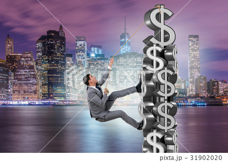 Businessman climbing dollar challenge tower Businessman climbing dollar challenge tower 31902020