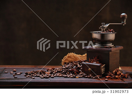 Coffee beans and grinder. 31902973