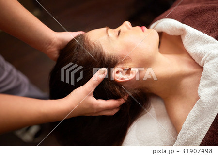 woman having head massage at spa woman having head massage at spa 31907498