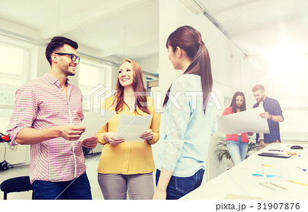 creative team on coffee break talking at office 31907876