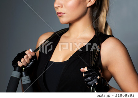 close up of sporty woman with jumping rope close up of sporty woman with jumping rope 31909893