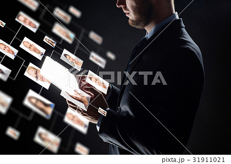 close up of businessman with transparent tablet pc 31911021