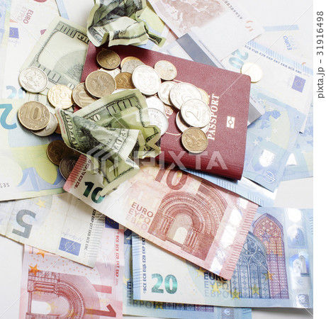Cash on table isolated: dollars, euro, rubl broken Cash on table isolated: dollars, euro, rubl broken 31916498