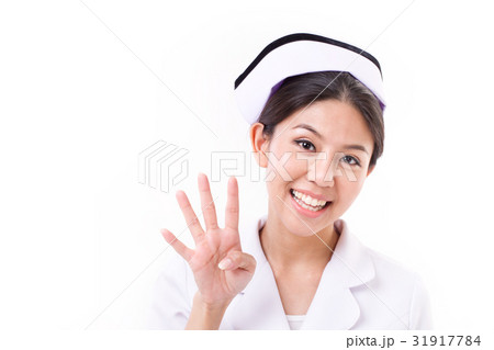 nurse pointing up, raising four finger nurse pointing up, raising four finger 31917784