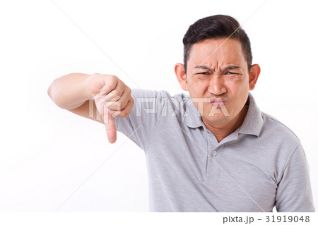 angry, frustrated man giving thumb down gesture angry, frustrated man giving thumb down gesture 31919048