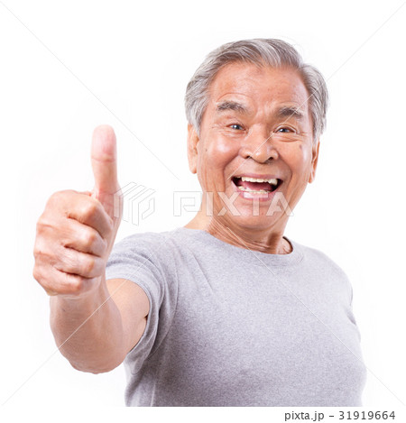 smiling senior old man showing thumb up gesture smiling senior old man showing thumb up gesture 31919664
