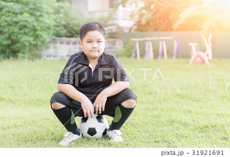 obese fat boy soccer player sit on football obese fat boy soccer player sit on football 31921691