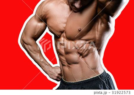 Caucasian sexy fitness model in gym close up abs. 31922573