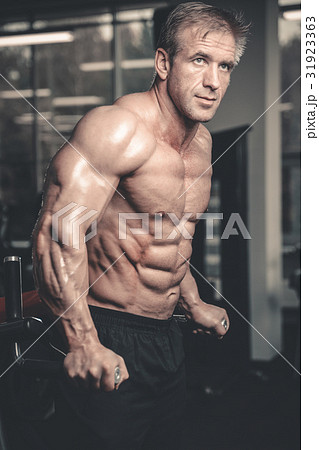 Brutal caucasian handsome fitness men on diet training chest pum Brutal caucasian handsome fitness men on diet training chest pum 31923363