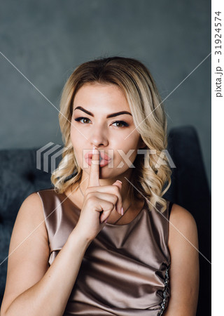 Surprised woman with hand over mouth 31924574