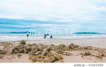 Sand with family playing in the sea on the blur 31925303