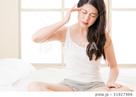 asian woman suffering headache and massage 31927966