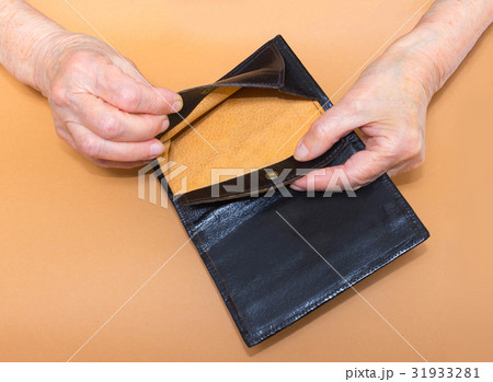 Senior woman sitting on window sill with empty 31933281