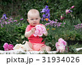 Little girl is playing with flowers, 31934026