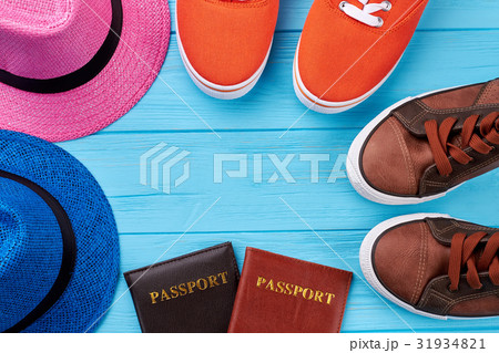 Sport shoes, hats, passports. 31934821