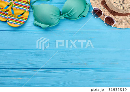 Woman beach accessories on sea background. 31935319