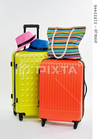 Hats and handbag on suitcases. Hats and handbag on suitcases. 31935446
