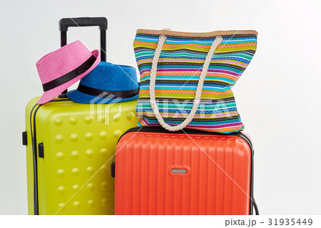 Bright accessories on summer suitcases. Bright accessories on summer suitcases. 31935449