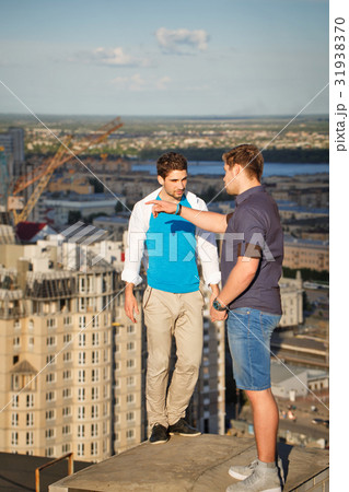 Two roofers on housetop Two roofers on housetop 31938370