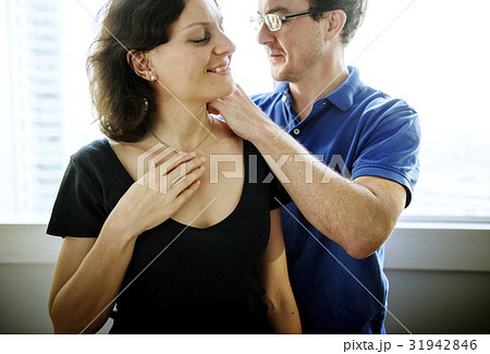A man giving a necklace to woman. A man giving a necklace to woman. 31942846