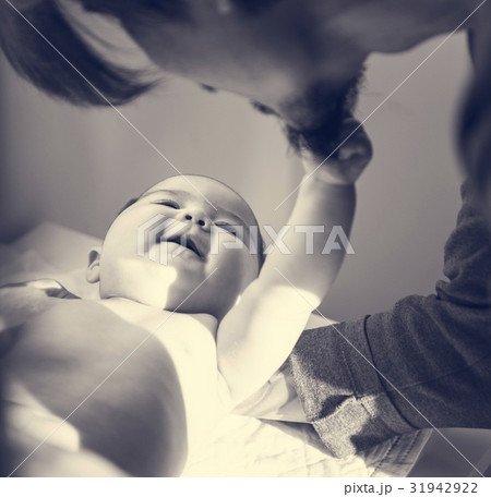 Father is taking care of his child. Father is taking care of his child. 31942922