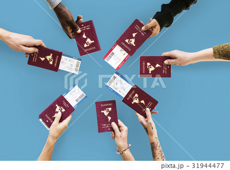 Group of hands holding passport in aerial view Group of hands holding passport in aerial view 31944477