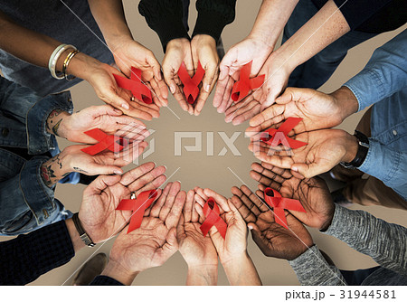 Group of hands holding red ribbon stop drugs and HIV/AIDS awareness 31944581