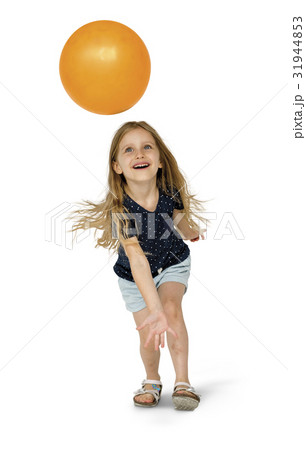 Young caucasian girl with an orange ball 31944853