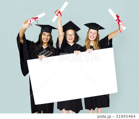 Diverse Students wearing Cap and Gown Showing Blank Copy Space Studio Portrait Diverse Students wearing Cap and Gown Showing Blank Copy Space Studio Portrait 31945464