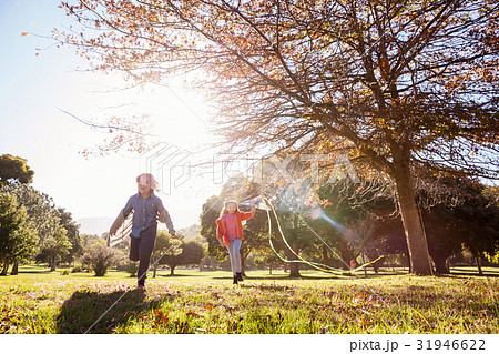 Playful children running in park 31946622