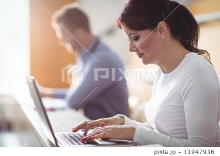 Mature student using laptop Mature student using laptop 31947936